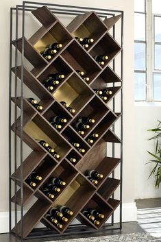 a wine rack with many bottles in it