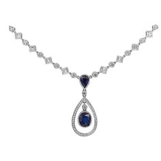 A beautiful drop necklace, featuring oval and pear shape blue sapphires weighing 4.29 carats total, finished with milgrain edges. Oval sapphire is accented by a round cut diamond halo in an open-work design. Suspended on a vintage-style diamond encrusted chain. Alternating princess and round cut diamonds weigh 2.80 carats total. Finely made with 18K white gold.  Roman Malakov is a custom house, specializing in creating anything you can imagine. If you would like to receive a special quote on a c Blue Nile Jewelry, Sapphire Diamond Necklace, Diamond Drop Necklace, Vintage Style Necklace, Blue Sapphire Diamond, Modern Necklaces, Diamond Drops, Dream Jewelry, Diamond Halo