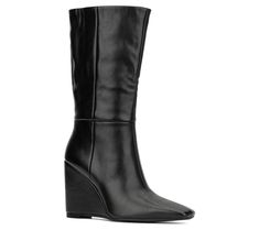 Combine comfort and style into one with this mid-calf wedge boot that elevates your ensemble to new heights. A side zip closure makes taking it on and off a breeze. From Torgeis. Chic High Ankle Wedge Boots For Spring, Black Mid-calf Boots With Stacked Heel And Wide Calf, Fitted Knee-high Heeled Boots With Zipper Closure, Fitted High Heel Knee-high Boots With Zipper Closure, Black Mid-calf Boots With Zipper Closure And Round Toe, Medium Width Knee-high Boots With Zipper Closure, Mid Calf, Wedge Boot, Side Zip