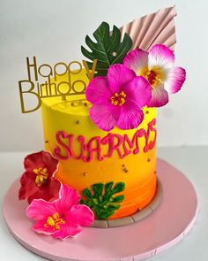 a yellow and pink birthday cake with flowers on the top that says happy birthday supreme