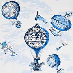 blue hot air balloons flying through the sky