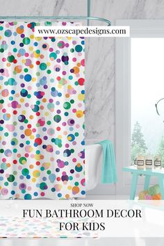 the bathroom is decorated in bright colors and has a shower curtain with colorful polka dots on it