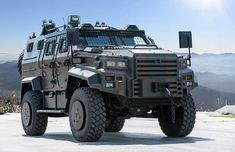 an armored vehicle parked on top of a mountain