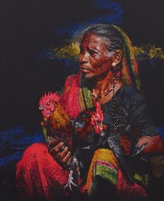 an old woman holding a chicken in her hands