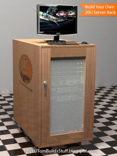 a computer monitor sitting on top of a wooden cabinet next to a black and white checkered floor