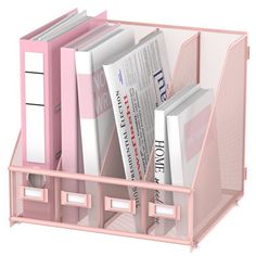 a pink desk caddy filled with books and magazines on top of a white background