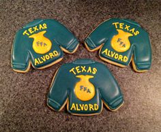 three decorated cookies with the words texas, tex and alvord written on them