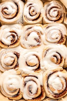 cinnamon rolls with icing in a baking pan