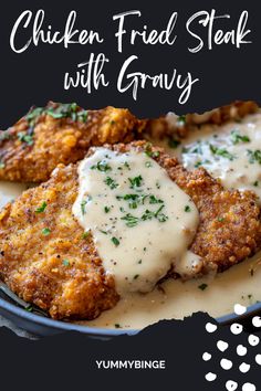 chicken fried steak with gravy in a skillet on a black and white background