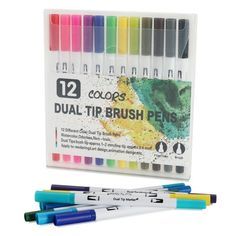 12 color dual - tip brush pens in a plastic case with two markers and one marker