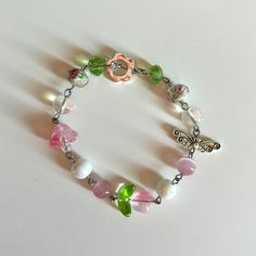 -I wish you roses bracelet inspired by the one and only kali uchis💐🫧 -Bracelet is handmade by me -Bracelet is made out of stainless steel and glass beads -Bracelet length is 7 inches but can be made shorter or longer just message me🎀 -Tags: Kali uchis, cottage core, fairy core, y2k, bracelet, aesthetic bracelet, pretty jewelry, dainty jewelry, flower bracelet, butterfly bracelet, pink, green, pink and green bracelet Fairy Core Beaded Jewelry, Kali Uchis Bracelet, Adjustable Fairycore Bracelets As Gifts, Fairy Core Bracelets, Butterfly Jewelry Aesthetic, Dainty Coquette, Coquette Fairy, Aesthetic Bracelet, Lily Bracelet