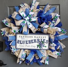 a blue and white wreath with the words farmers market, blueberries written on it