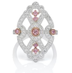 Expertly hand-crafted in white gold, this modern take on a classic 1920s Art Deco style ring highlights five bright pink diamonds and is embellished with over a carat of glittering white diamonds. 0.34CT 6P/PP/Intense Pink Argyle Pink Diamonds 1.11CT White Diamonds Platinum and 18KT Rose Gold Size 6.50 Diamond Art Deco Ring, Pink Argyle, Argyle Pink Diamonds, Argyle Diamonds, Shield Ring, Pink Diamonds, Art Deco Diamond Rings, 1920s Art, Right Hand Rings