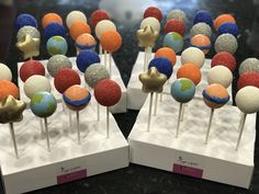 there are many cake pops with different designs on them