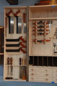 a wooden tool box filled with lots of tools