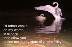 a swan is swimming in the water with its wings spread