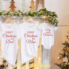 These First Christmas Family Shirts Mom Dad Baby First Christmas Matching Shirts are great option for family Christmas party or as a gift for family that will celebrate Christmas for the first time as a family. Family means everything. Have a very Merry Christmas. We proudly use Bella Canvas super soft tees! Our shirts are 100% made in the USA, high-quality unisex t-shirt that is insanely soft. In fact, it will be one of the softest, best fitting, most comfortable shirts you've ever owned.   - Details - - This is for 1 short sleeved graphic t shirt. - Please see size chart and shirt colors in product images.    T-shirt Features: - 100% Cotton (fiber content may vary for different colors) - Medium fabric (5.3 oz/yd² (180 g/m - Classic fit - Tear away label - Runs true to size   Care instruc Family Matching White Christmas Tops, Family Matching White Tops For Christmas, Family Matching Christmas T-shirt With Letter Print, White Family Matching Christmas T-shirt, Family Matching White Holiday Tops, Family Matching White Tops For Holiday, White Family Matching Holiday Tops, White Family Matching Tops For Holidays, Family Matching Christmas T-shirt