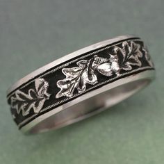 Leaves of the sturdy oak portrayed onto this band of gold. It will symbolize the strength of your relationship. This ring can be made in either 14k white gold, 14k rose gold or 14k yellow gold. All look fantastic. It is also possibe to make a beautiful matched ring set, one with white sapphire, as Groom Wedding Band, Leaf Wedding Band, Leaf Engagement Ring, Jewel Wedding, Nature Ring, Wedding Leaves, Matching Wedding Bands, Oak Leaves, Anniversary Bands