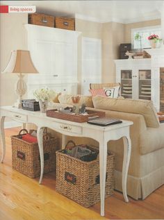 a living room filled with furniture and baskets