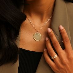 Our sleek and stylish DRD Paperclip Disc Charm Necklace adds modern sophistication to any look. The large, polished gold pendant pairs cleanly with our coveted 14 karat gold paperclip chain. This wear-with-everything necklace is a timeless addition to any neck stack. Want to make it more personal? Add engraving, or your favorite charms to make this piece truly unique! 14 Karat Gold Disc is 25.2mm in Diameter Adjustable Length 20" Paperclip Chain To add a heart to your engraving, use "*" in the text box above. Please note engraving will add up to 10 days to delivery time To add a custom charm, please email info@danarebeccadesigns.com Additional Charms Sold Separately 14k Gold Paperclip Chain Chain Length: 20" Links Measure 9.9mm x 2.5mm Lobster Clasp Modern Rose Gold Tarnish-resistant Necklaces, Elegant Link Jewelry For Work, Modern Gold Chain Pendant Jewelry, Sleek Jewelry Gift, Modern Rose Gold Jewelry With Cable Chain, Sleek Round Jewelry For Gift, Minimalist Rose Gold Paperclip Chain Jewelry, Modern Tarnish Resistant Pendant Chain Necklace, Modern Tarnish-resistant Pendant Chain Necklace