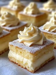 several pieces of cake with white frosting on top