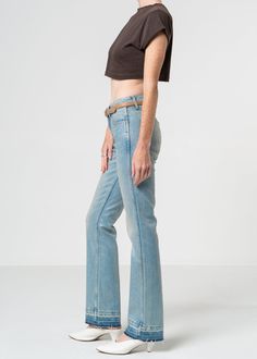 Crafted with an elegant, low-sitting fit and finished with a timeless bootcut silhouette, this light-tinted, clear-coated jean features a stylishly-released hem. Model is 5'10" wearing size 26. Approx. Front rise: 9" Inseam: 33"Approx. Knee: 14.5" Leg opening: 16.5" 94% Cotton, 4% Polyester, 1% SpandexMade in USA Fits true to size. Fitted Flare Jeans With Frayed Hem, Fitted High Rise Faded Flare Jeans, Fitted Flares With Frayed Hem, Faded Flare Fitted Jeans, Fitted Light Wash Flare Jeans With Frayed Hem, Fitted Faded Flare Jeans With Frayed Hem, Spring Faded Fitted Flare Jeans, Fitted Flare Faded Jeans, Fitted Washed Flare Jeans