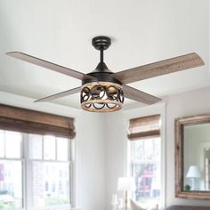 a ceiling fan that is hanging in a room