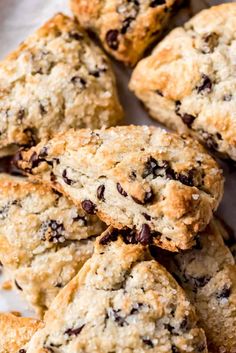 chocolate chip scones piled on top of each other with one broken in the middle