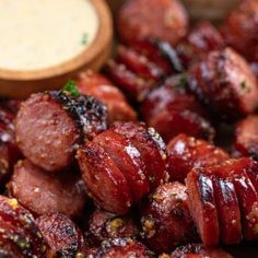 bacon wrapped in ketchup and garnished with parsley on the side