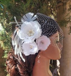 "Here is a beautiful set of set 9f three white flower clips and bandeau birdcage veil. The flowers attached to alligator clips. Ostrich feathers attached to the flower clip. The center of the biggest flower decorated with rhinestone brooch and the smaller flowers decorated with natural  freshwater pearls and rhinestone crystals.  The veil and the flower fascinators are separate pieces. The veiling is white color.  The bandeau veil is attached to the bobby pins. The veiling part is very versatile Adjustable White Headpiece For Wedding, Wedding Fascinator With Flower Decoration, White Handmade Flower Headpieces For Wedding, White Wedding Headpieces With Handmade Flowers, White Wedding Fascinator With Handmade Flowers, Adjustable White Hair Accessories With Handmade Flowers, White Adjustable Hair Accessories For Ceremony, Elegant Wedding Hair Accessories With Flower Decoration, Elegant Flower Wedding Hair Accessories