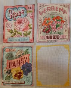 four different types of cross stitch designs on a white cloth with yellow trimmings