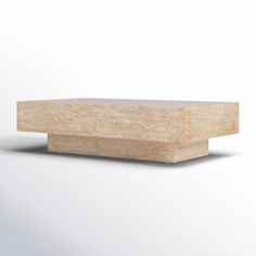 a wooden block sitting on top of a white surface