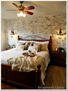 a bed room with a neatly made bed and a ceiling fan