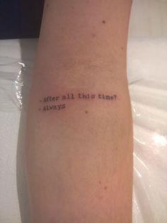 a person with a tattoo on their arm that says, after all this time? always