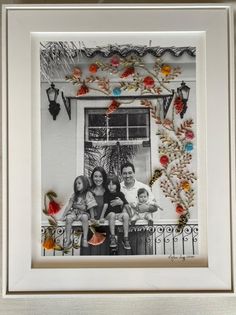 a family photo hanging on the wall