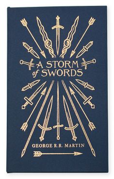 a blue book with gold lettering and arrows on the cover, which reads a storm of swords