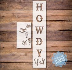 a wooden sign that says hollywood with an image of a bird and flowers on it