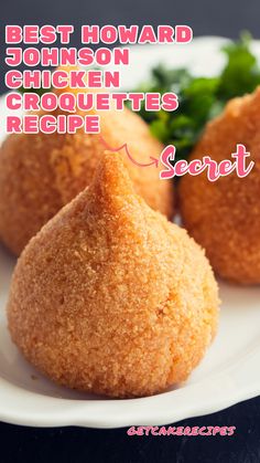 three fried chicken croquettets on a white plate