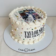 a white cake with photos on it and the words taylor swift, the easy step