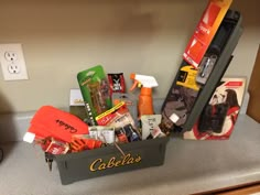 a box filled with assorted items sitting on top of a counter