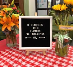 a sign that says if teachers were flowers, we would pick you on the table