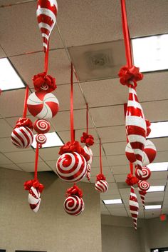 christmas decorations hanging from the ceiling in an office cubicle, and decorated with candy canes