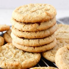 a stack of cookies sitting on top of a piece of wax paper next to each other