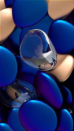 an abstract photograph of blue and brown circles with a glass object in the foreground