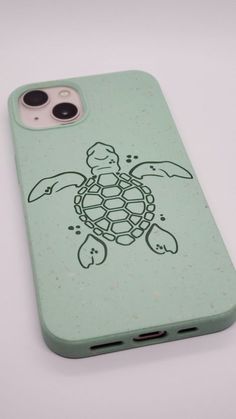 an iphone case with a drawing of a turtle on it's back cover is shown