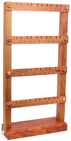 a wooden rack with holes in it