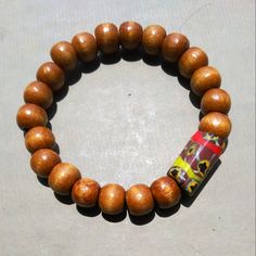 I Let The Sizeable Antique African Trade Bead Do The Talking. The Rest Of The Bracelet Is Honey-Colored, Large Wood Beads. The Stretch Elastic Is Hardy So Wear Without A Care! This Is A Women's M/L And A Men's S/M. Ish. It All Depends On How You Like Your Fit. It's Chunky Yet Can Be Unisex. There Is A Penny Shown For Scale. Let Me Know What's On Your Mind, *Pennyroyal* Adjustable Yellow Bracelet With Wooden Beads, Yellow Wooden Bead Bracelets, Yellow Bracelet With Round Wooden Beads, Yellow Wooden Beads Bracelet, Yellow Wooden Beads Bohemian Bracelet, Adjustable Yellow Wooden Beaded Bracelets, Spiritual Yellow Bracelets With Colorful Beads, Motorcycle Chain Bracelet, Bullet Necklace