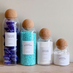 three bottles with different types of candies in them