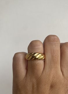 This crossiant band is such a popular design right now. We wanted to create a fun inexpensive version so you can have the look for less. The back is open for comfort which makes it great for stacking on many fingers. *size 7.5 *4mm band face *Gold plated over stainless steel Braided Gold Ring, Nike Ring, Braid Rope, Croissant Ring, Rope Ring, Rope Rings, Chunky Ring, Braided Ring, Dome Ring