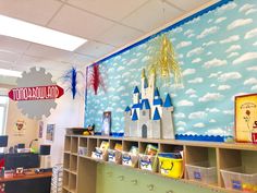 a classroom with lots of toys and decorations on the wall, including bookshelves